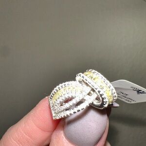 Yellow diamond and white diamond baguette ring with a silver band